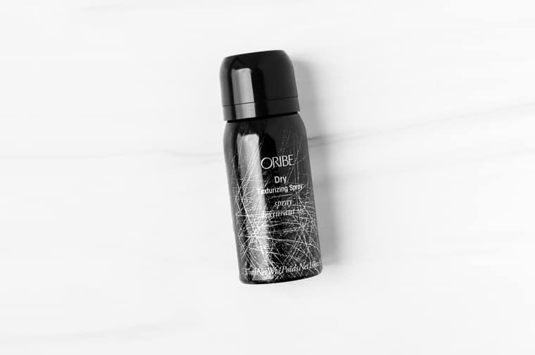 Oribe dry texturizing spray on a white background