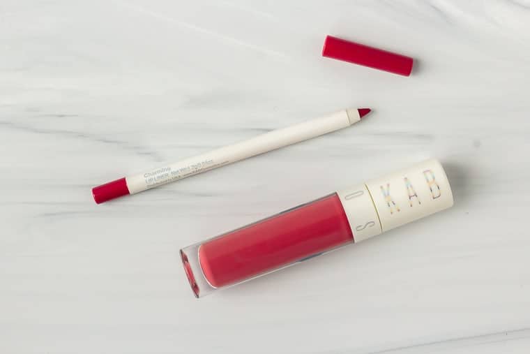 KAB cosmetics Charming lip gloss and lip liner on a white background
