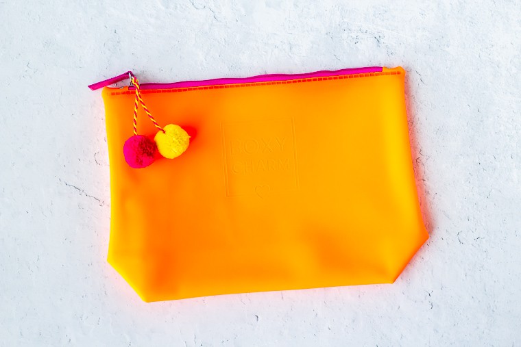 Silicone pouch in orange on a white background