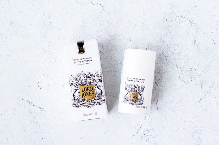 Lord Jones HIgh CBD Formula Body Lotion in unscented with the tube next to the package on a white background