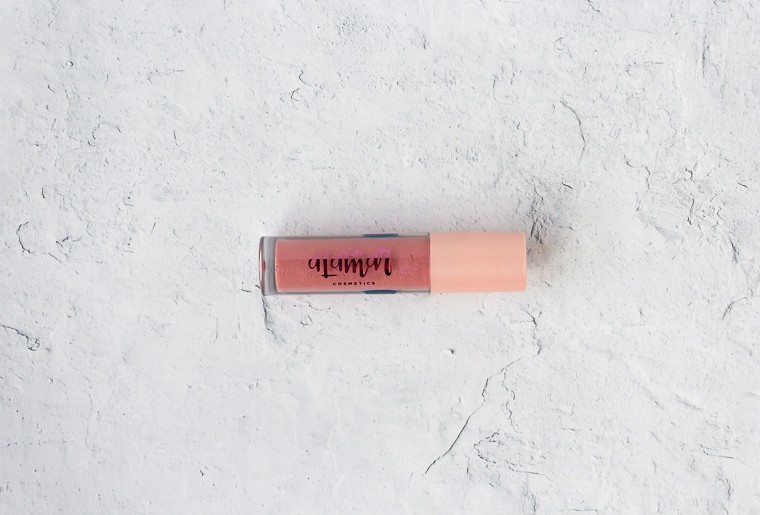 Alamar Cosmetics Birthday Suit Lip Gloss on a white background