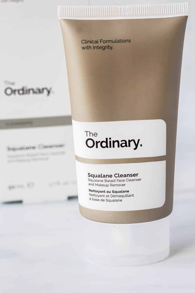 A tube of The Ordinary Squalane Cleanser with the box behind it on a white background