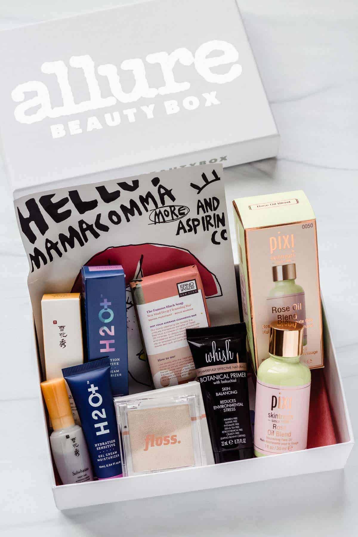 The August 2020 Allure Beauty Box opened with all of the items displayed inside