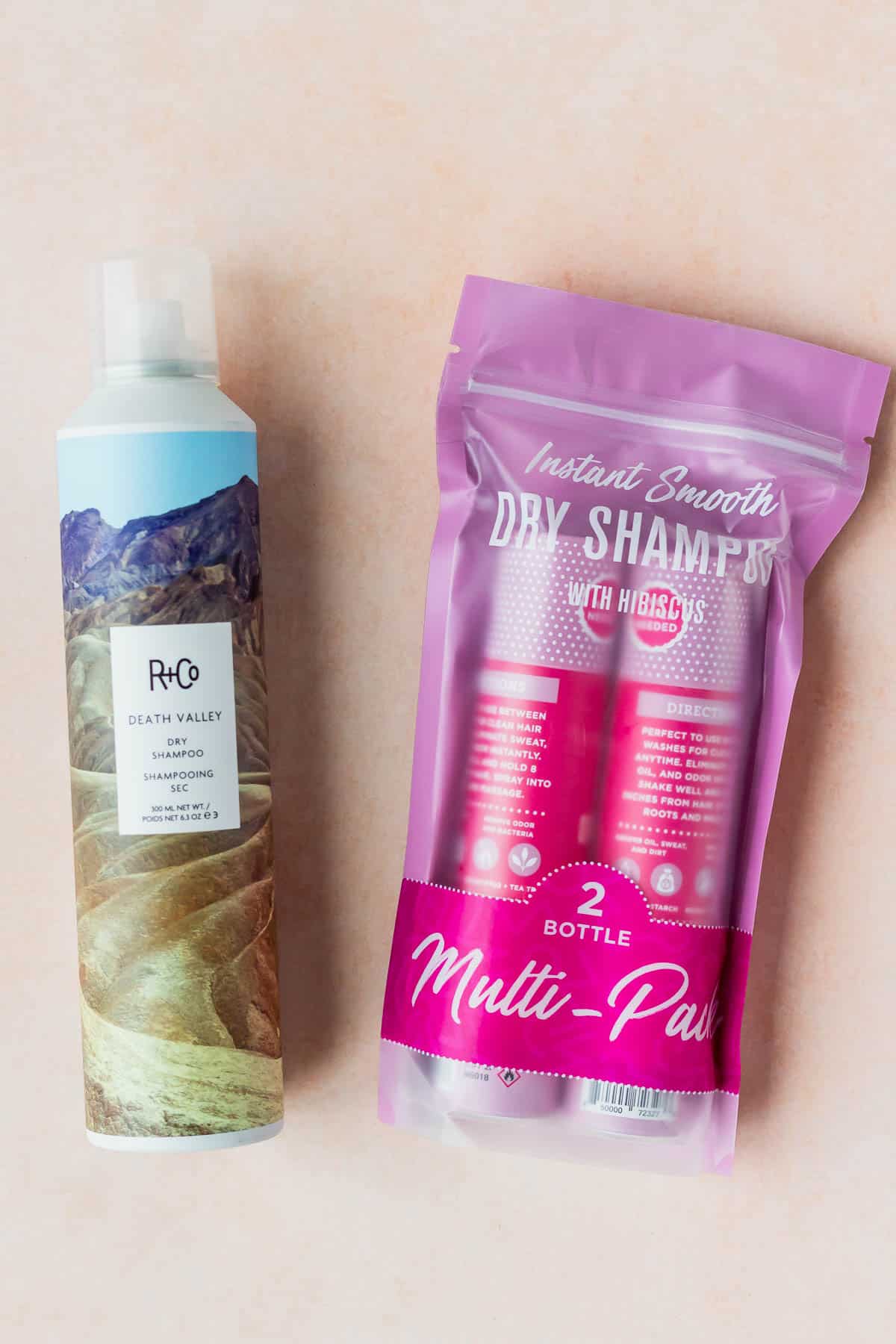 R + Co Dry Shampoo and a 2 pack of hibiscus dry shampoo on a peach backdrop 