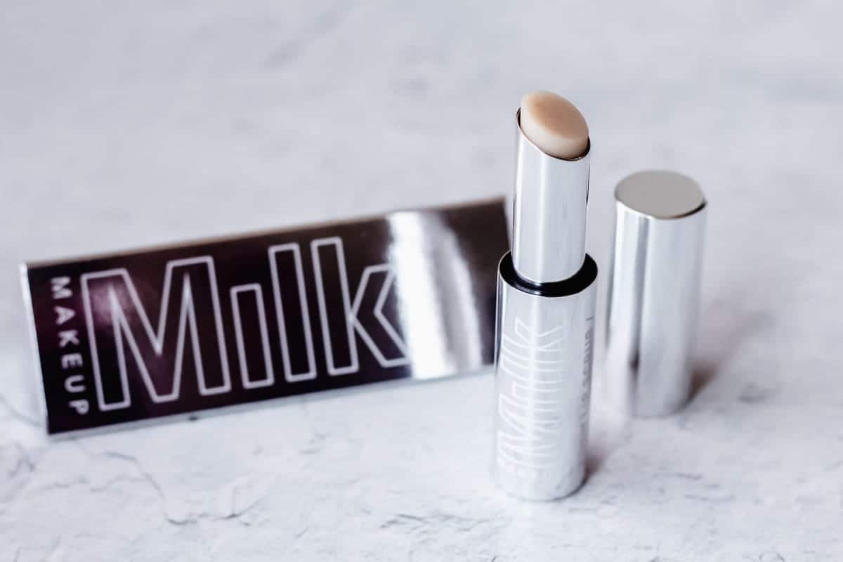 Milk Makeup Kush Lip Scrub tube and packaging on a white background
