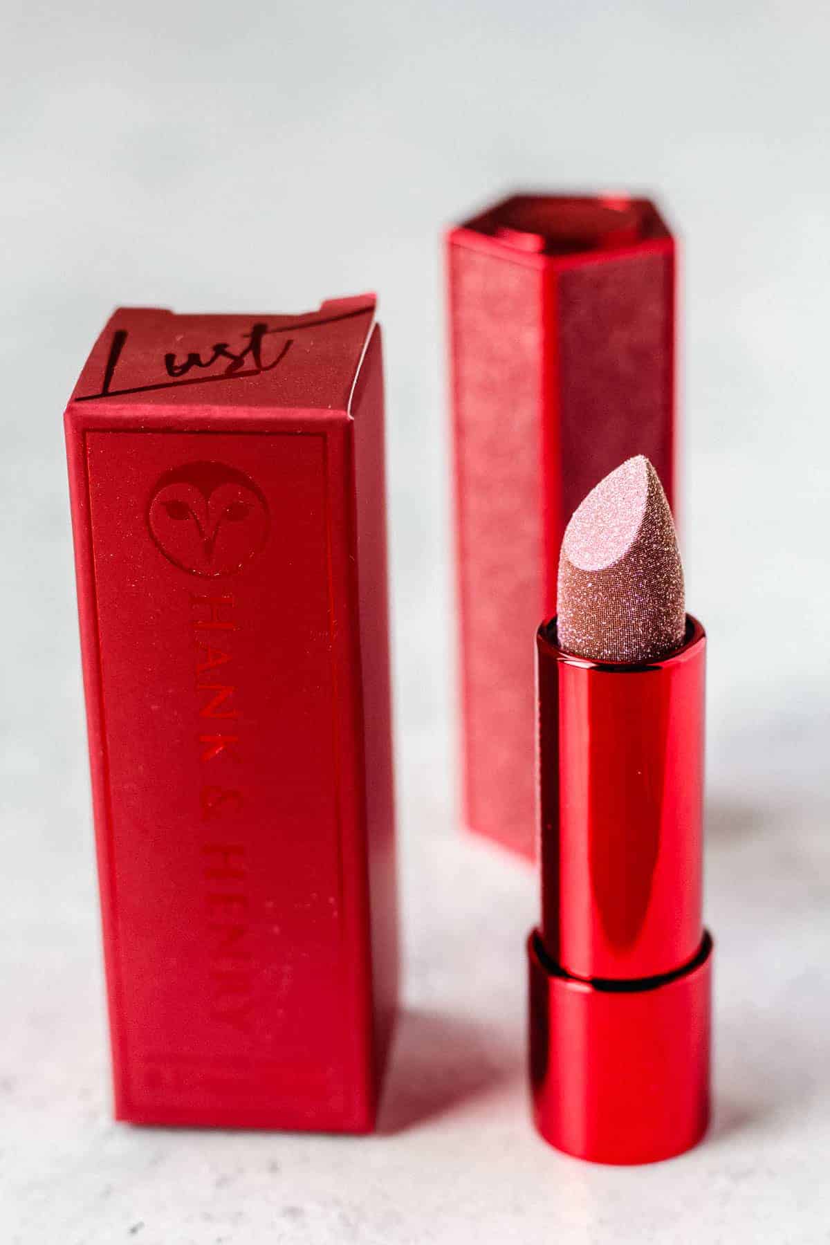 Hank and Henry Lip Love Luxe Lipstick opened next to it's packaging