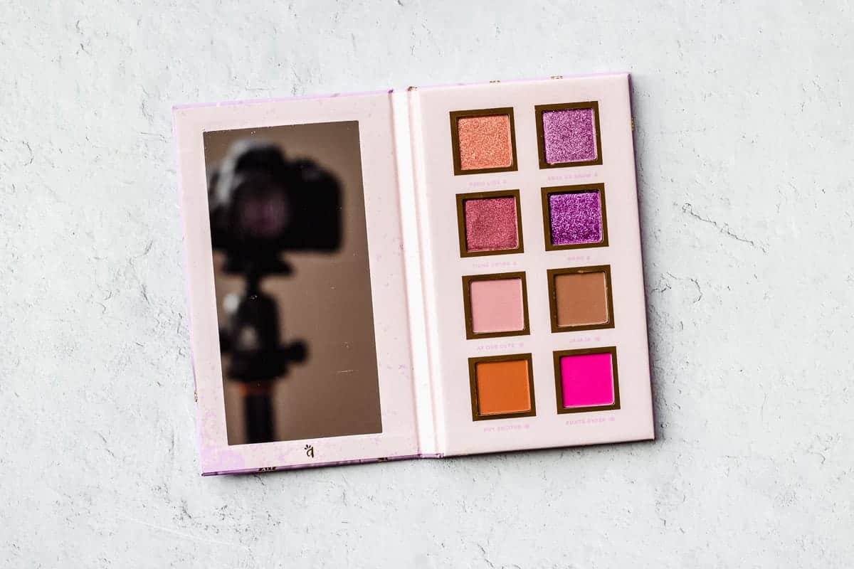 Alamar Spanglish eyeshadow palette opened to show the colors inside