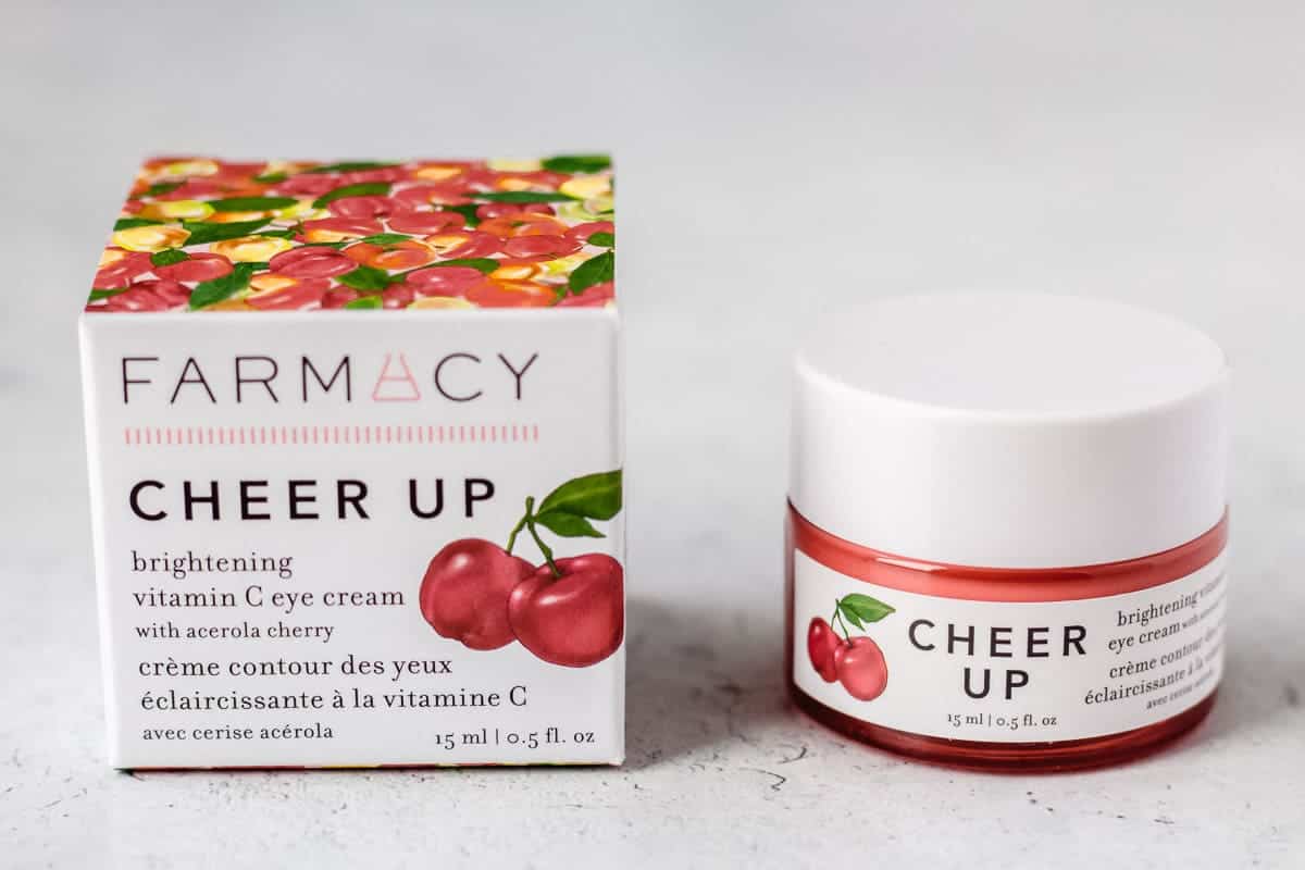 Farmacy Cheer Up Eye Cream and it's box on a white background