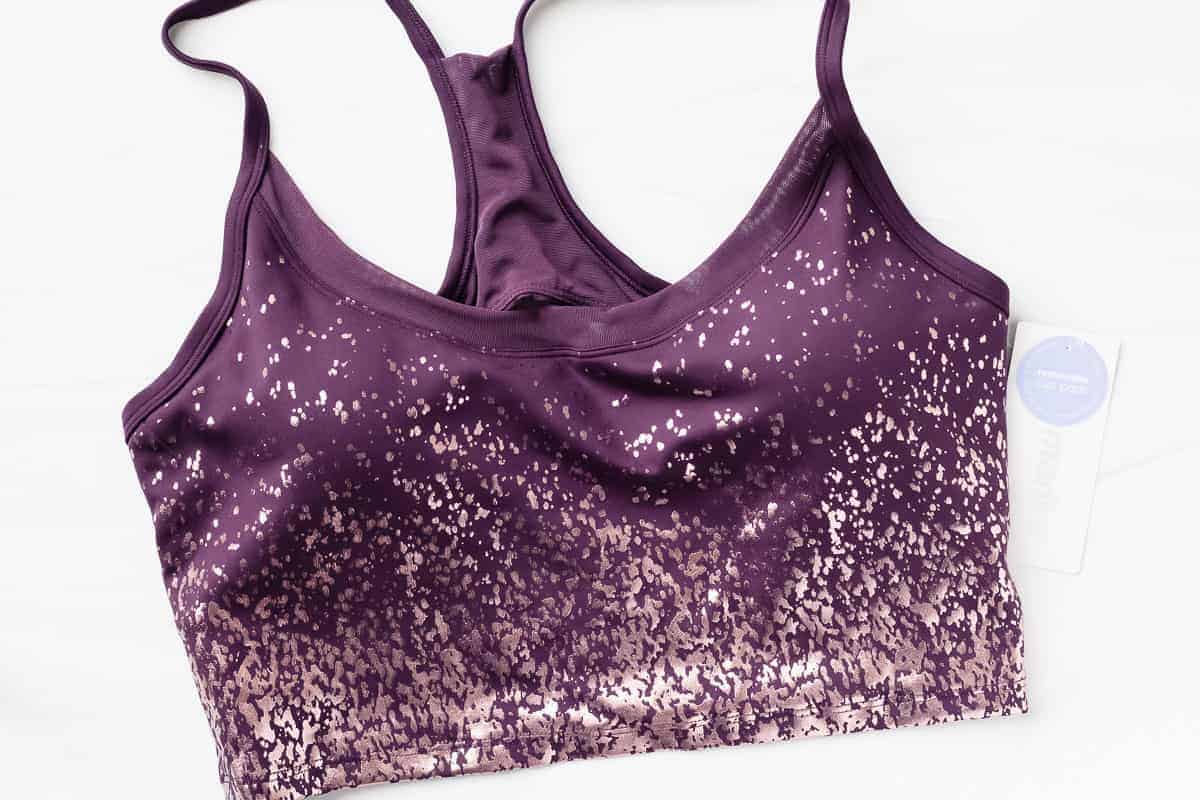Marika Ivy Sports Bra in a plum color with rose gold sparkle print