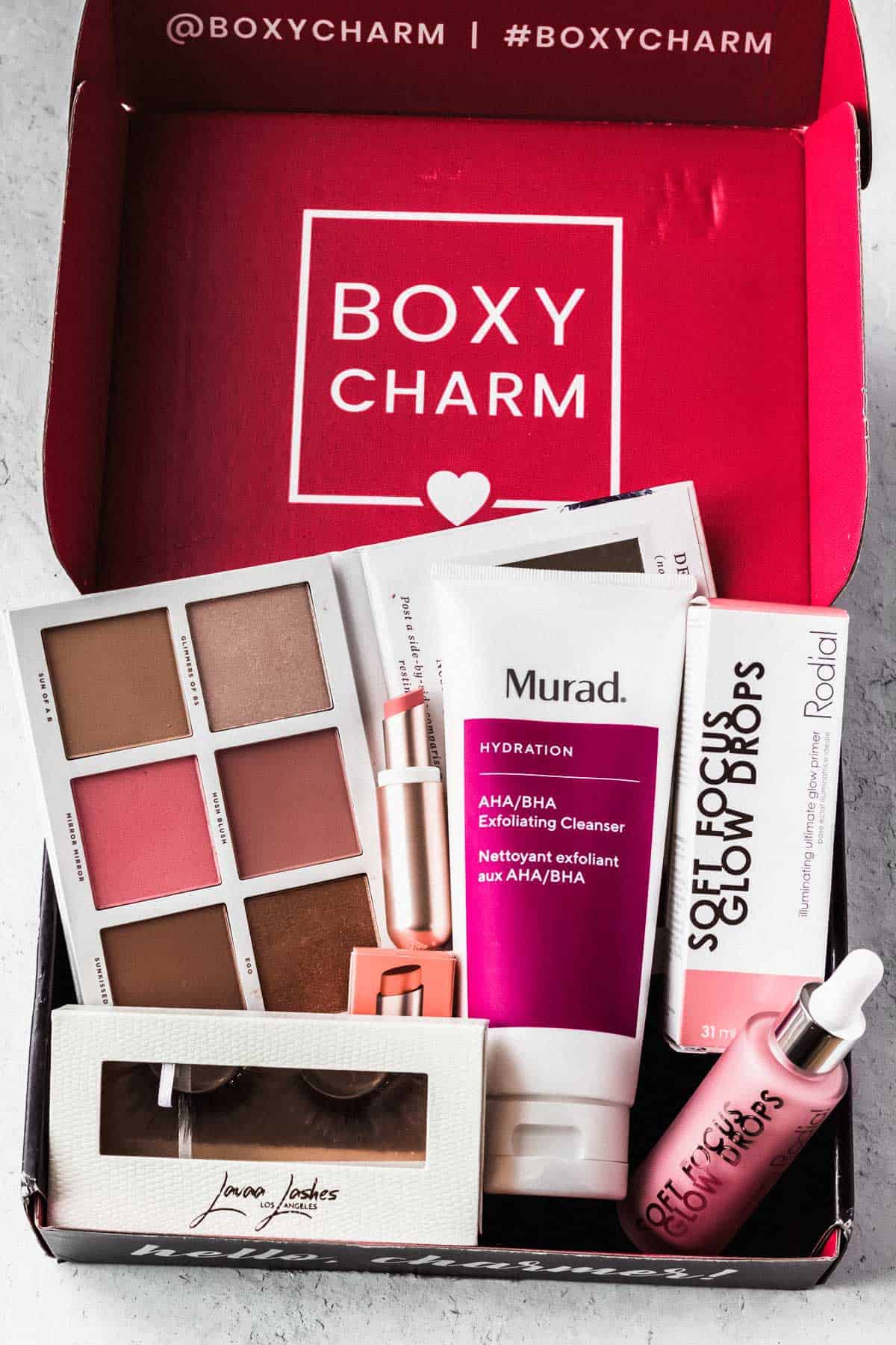 Opened October 2020 Boxycharm base box with all of the items displayed inside.