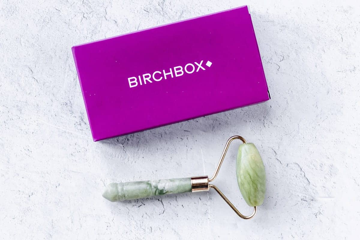 Birchbox Jade Roller and pink box on a white background