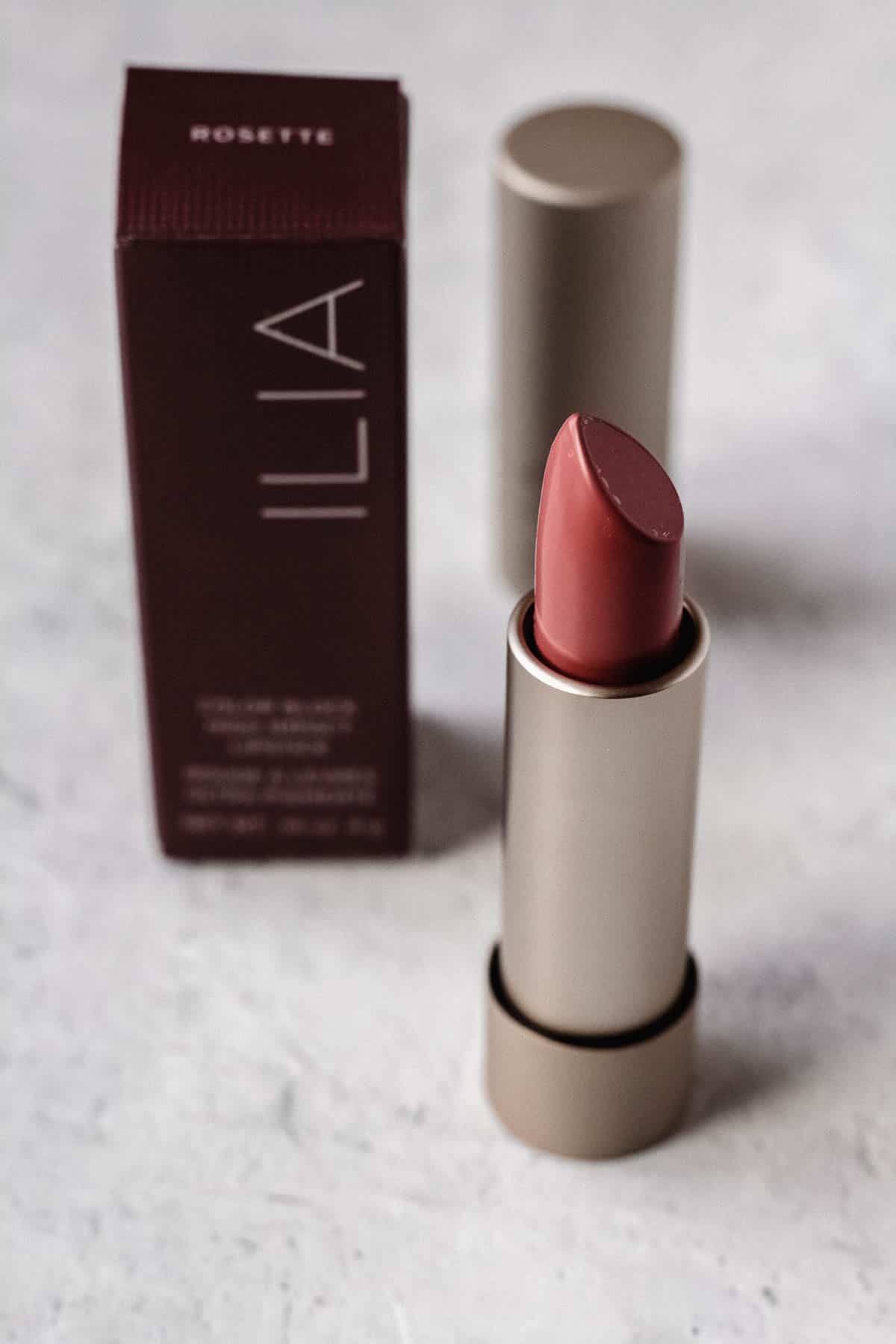 Ilia Beauty lipstick in rosette on a white background