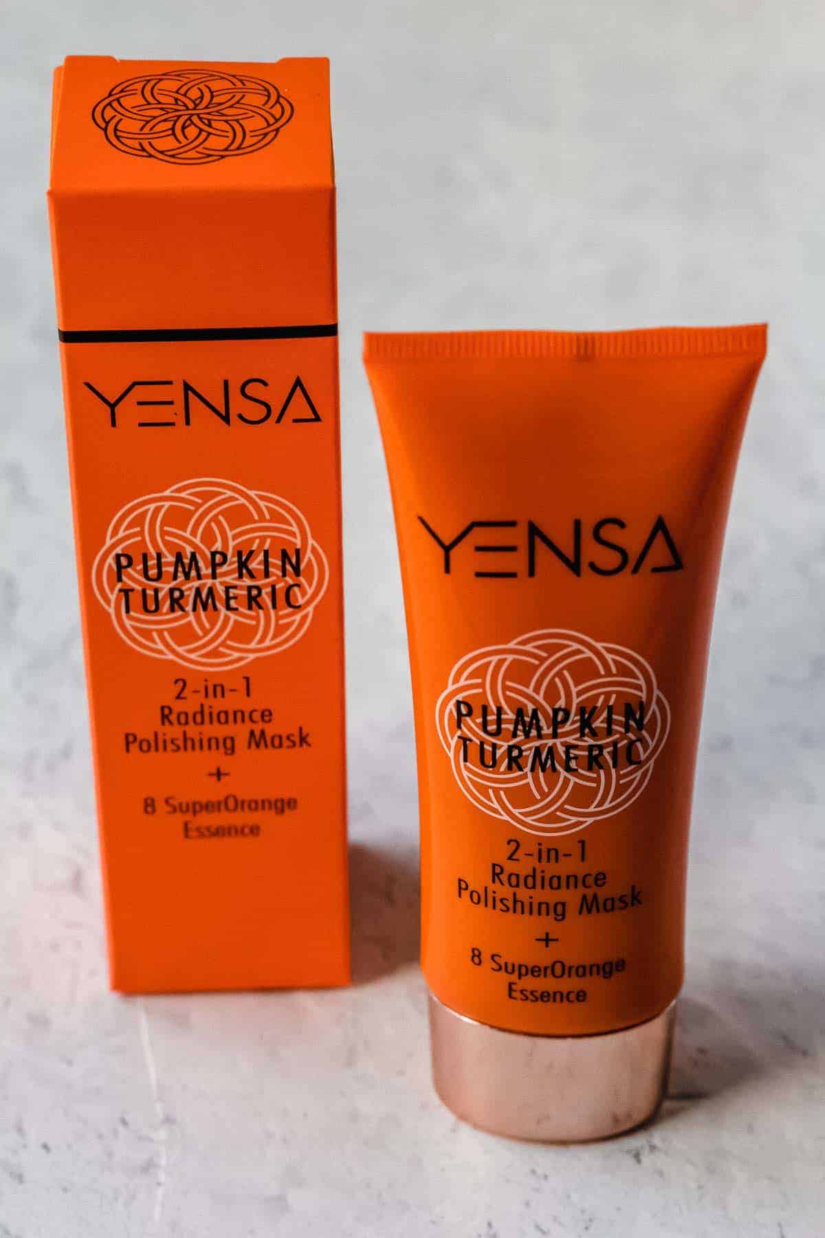 Yensa Pumpkin Turmeric 2-in-1 Radiance Polishing Mask and it's packaging on a white background
