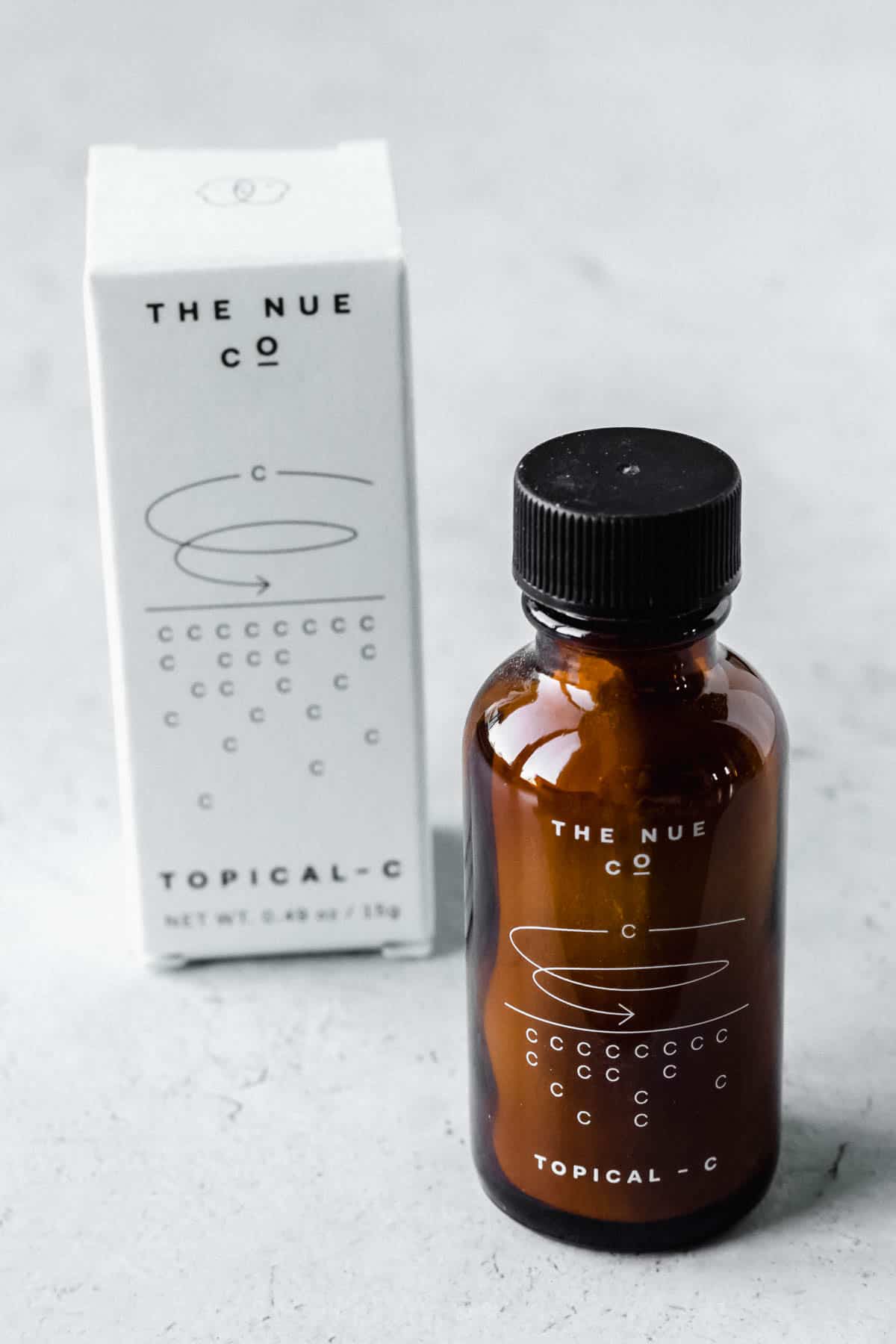 The Nue Co. Topical C bottle and box on a white background