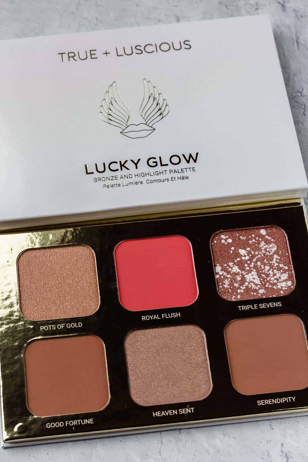 Lucky glow bronzer and highlighter palette on a white background