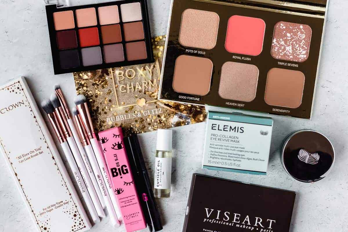 Items from the December 2020 Boxycharm Premium box laid out on a white background