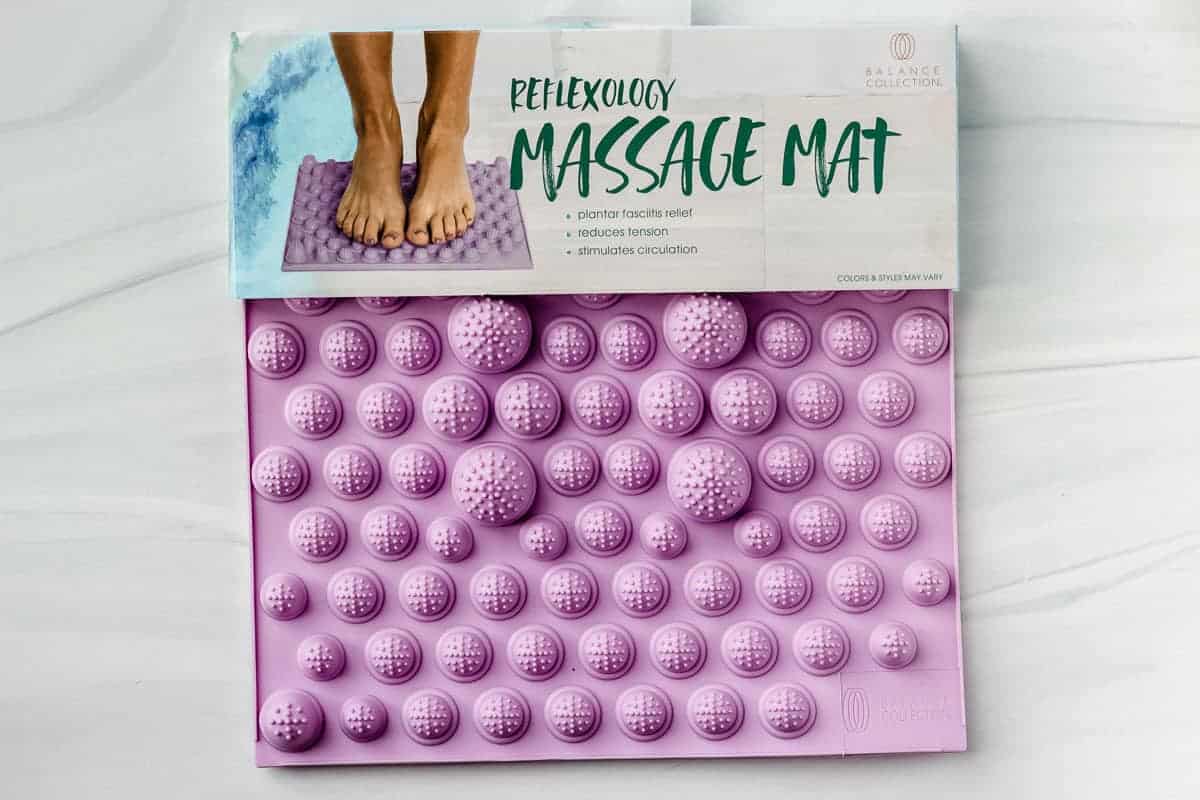 a light purple square massage mat