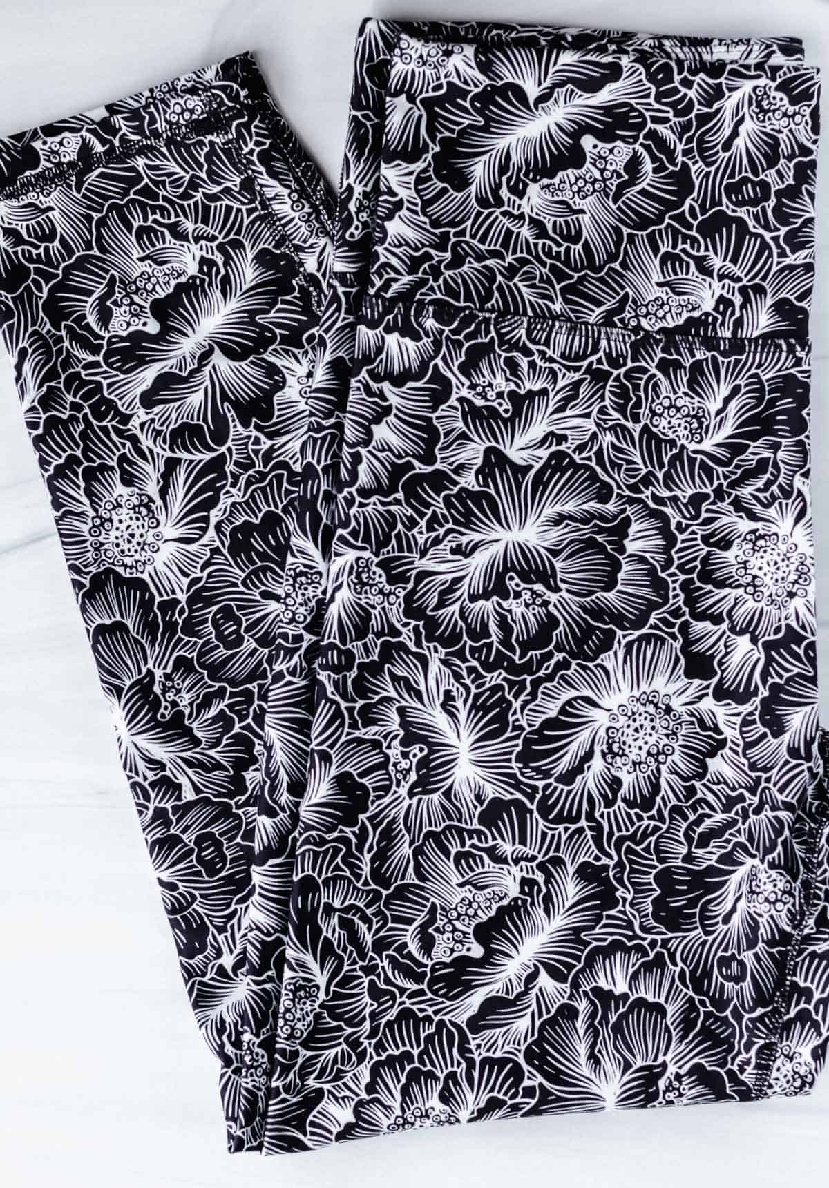 Marika High Waisted Ankle Leggings with black and white floral print on a white background