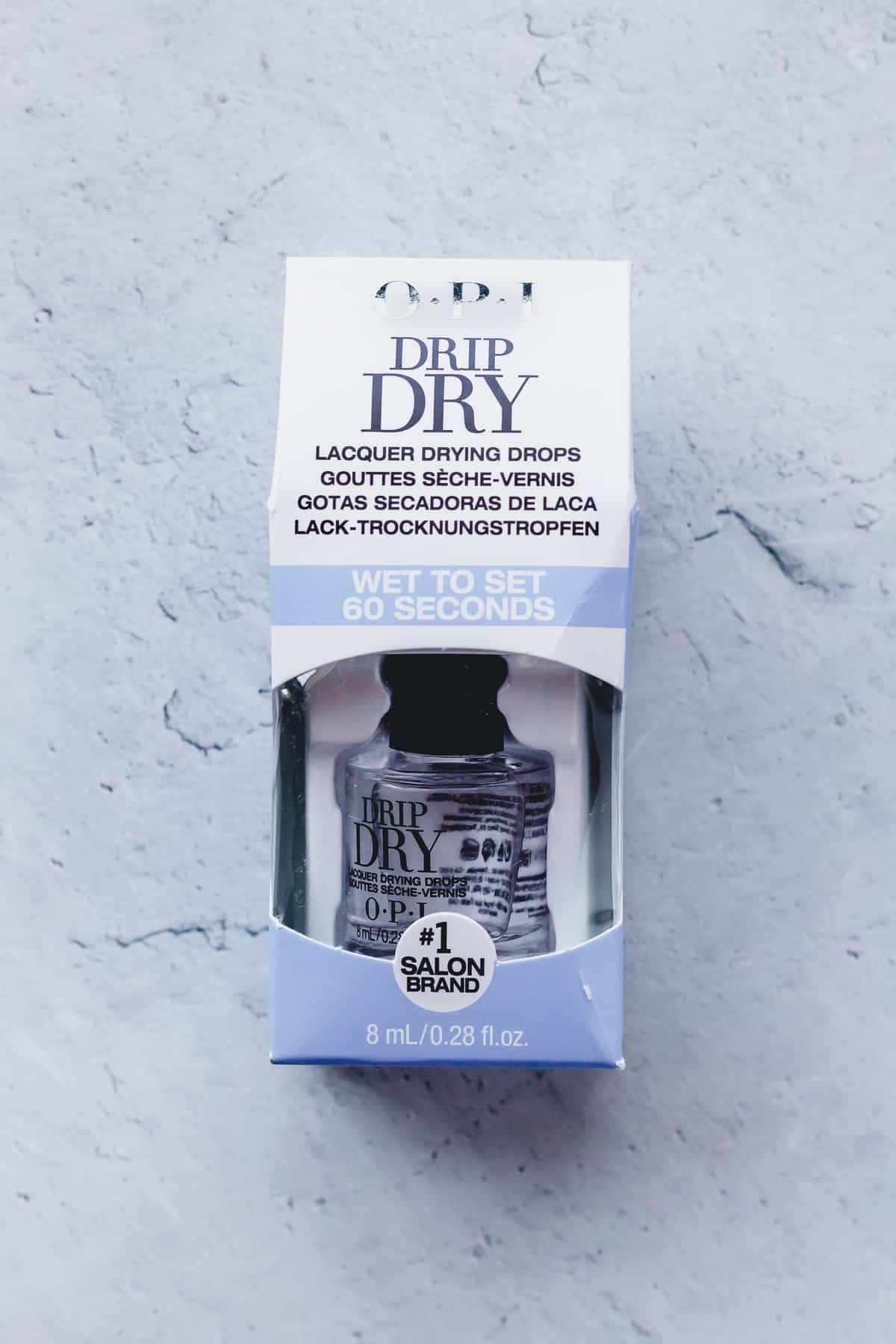 OPI Drip Dry in package on a gray background