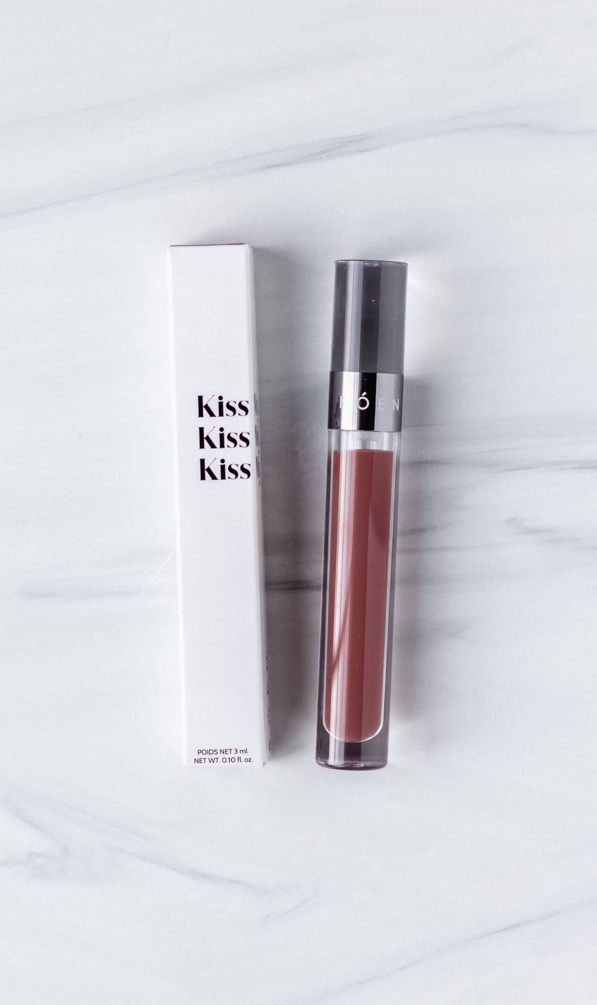 Roen Beauty Kiss My Liquid Lip Balm in Charlie with box on a white background