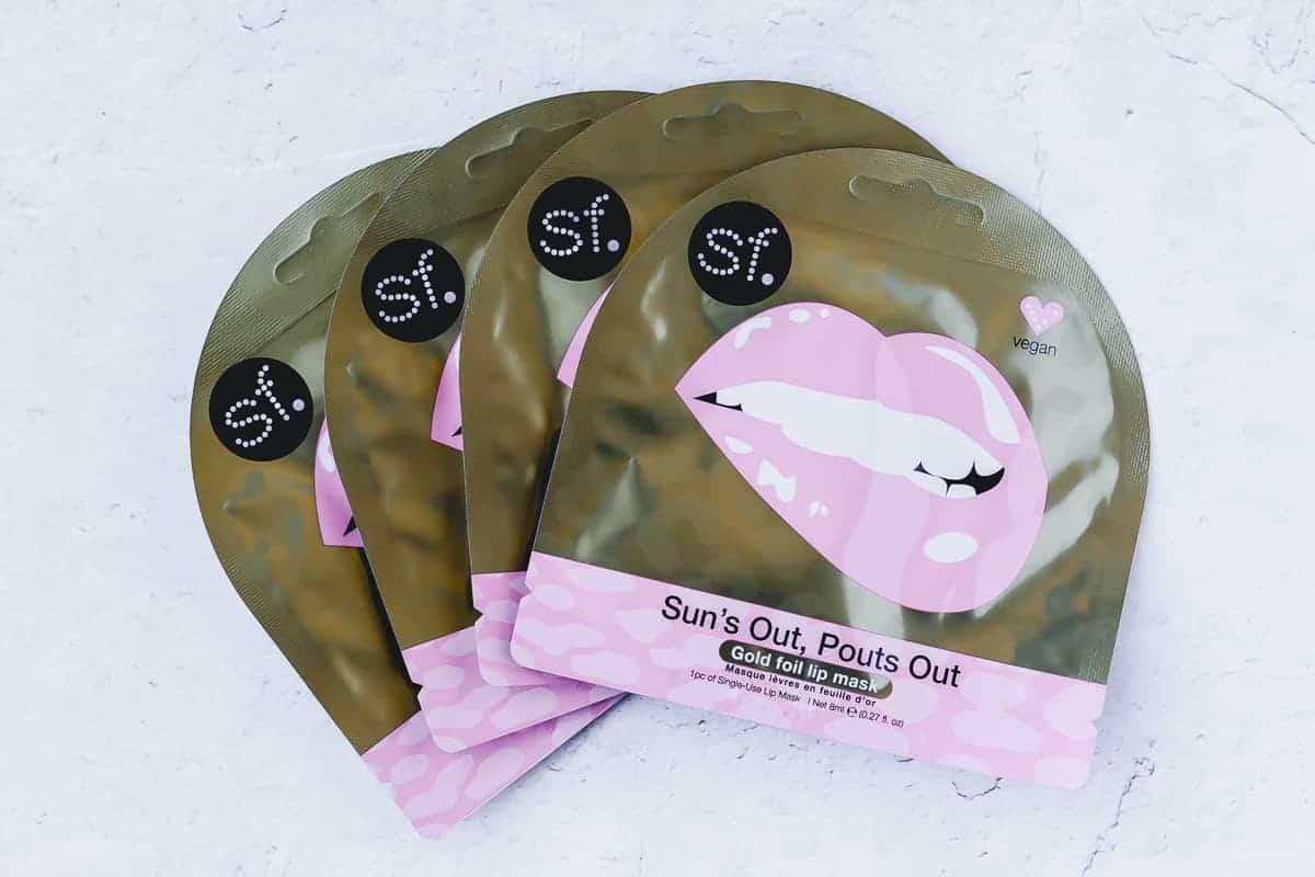 Skin Forum Sun’s Out, Pouts Out Lip Mask packets on a white background