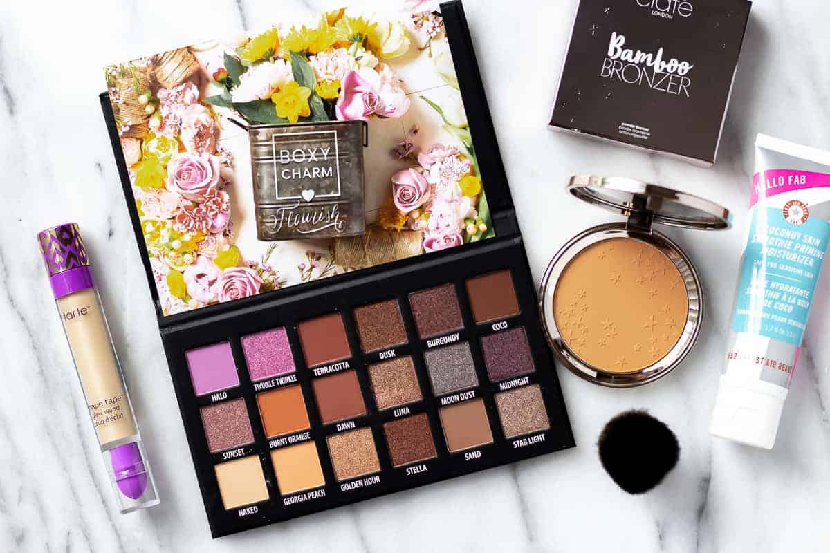 All of the items from the May 2021 boxycharm base box displayed on a marble background