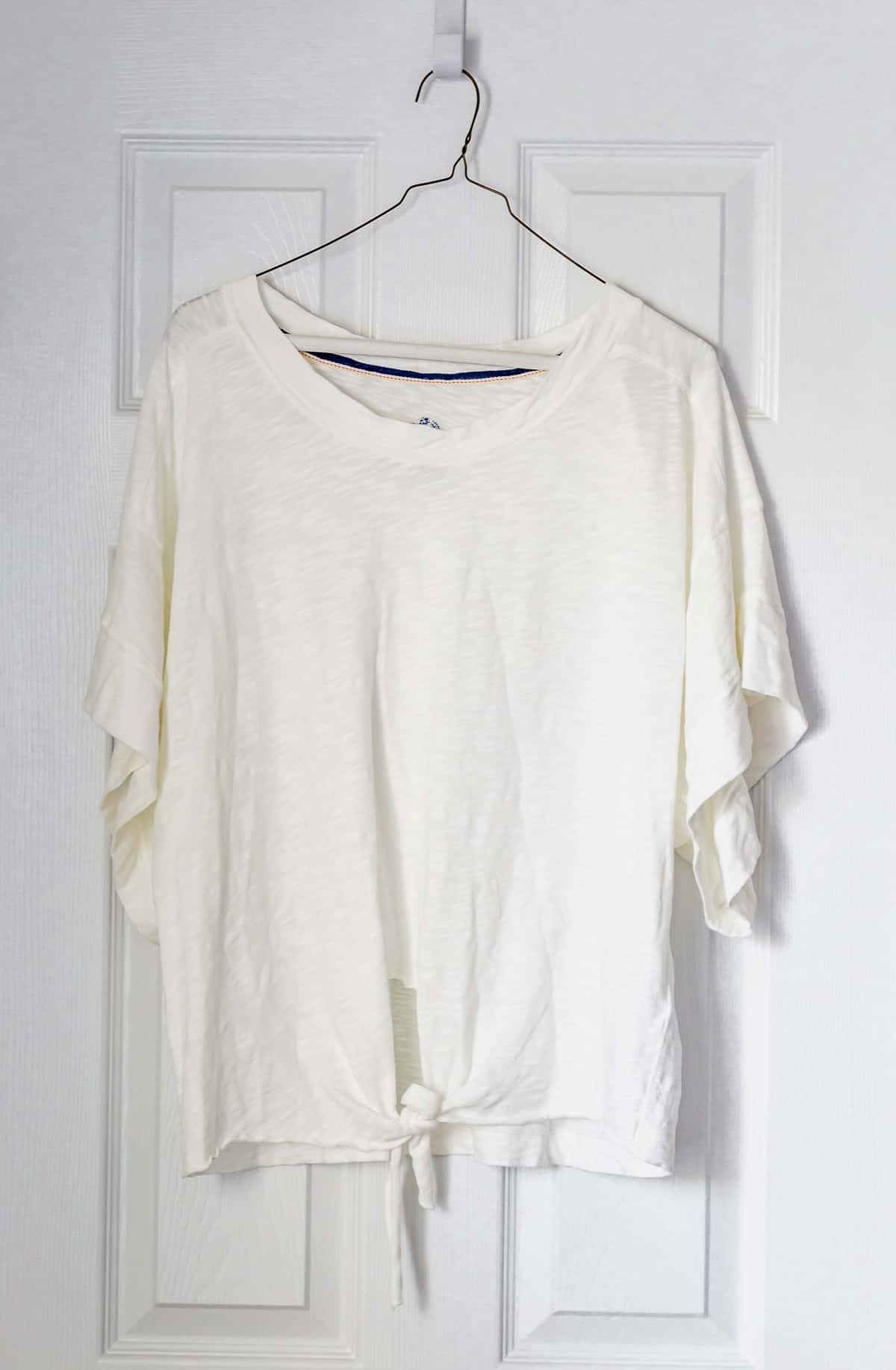 Pilcro shelley washed top in ivory on a hanger