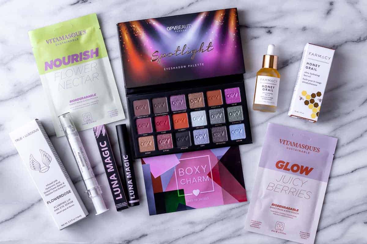 All of the items from my June 2021 Boxycharm box on a marble background