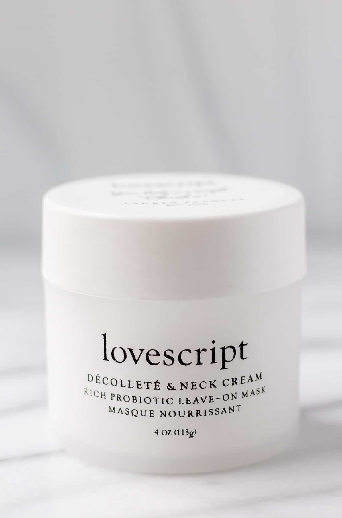 Lovescript Decollete and Neck Cream Jar on a light background