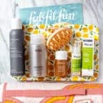 All of the items from my summer 2021 fabfitfun box laid out on a marble background with text overlay