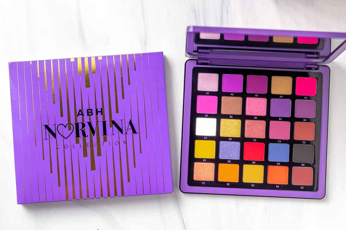 NORVINA® Pro Pigment Palette Vol. 1 opened next to its box on a white background