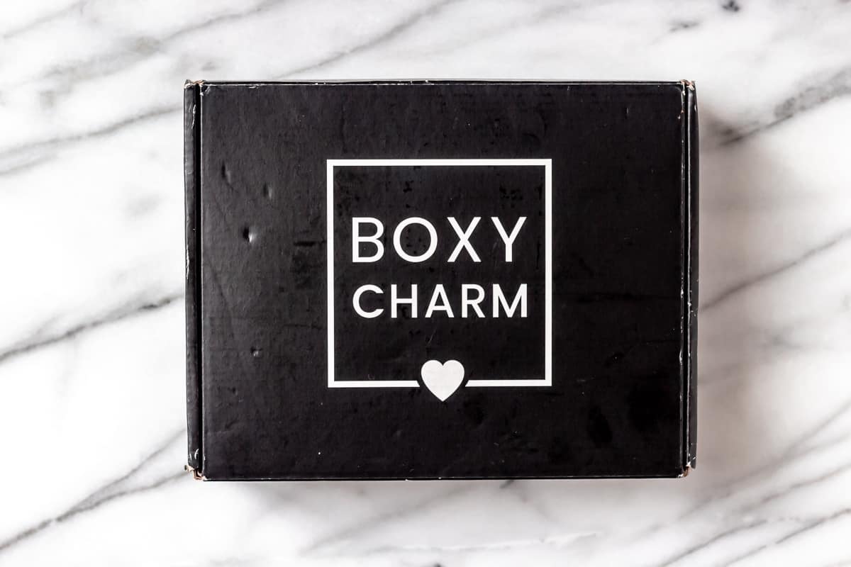 July 2021 boxycharm box on a marble background
