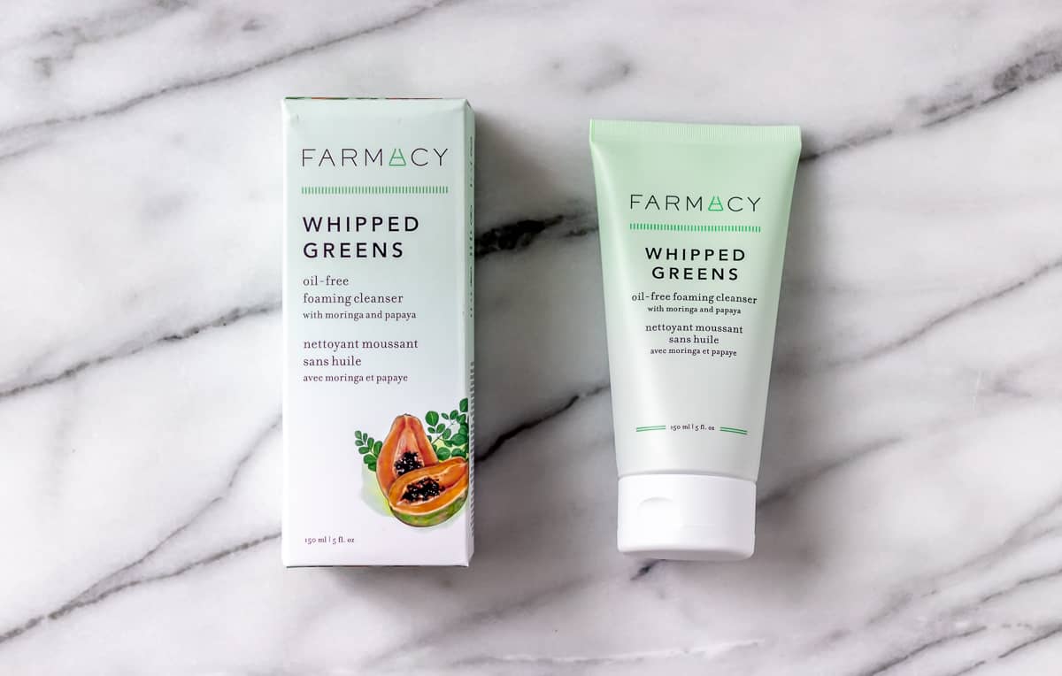 farmacy Whipped Greens Foaming Cleanser on a marble background
