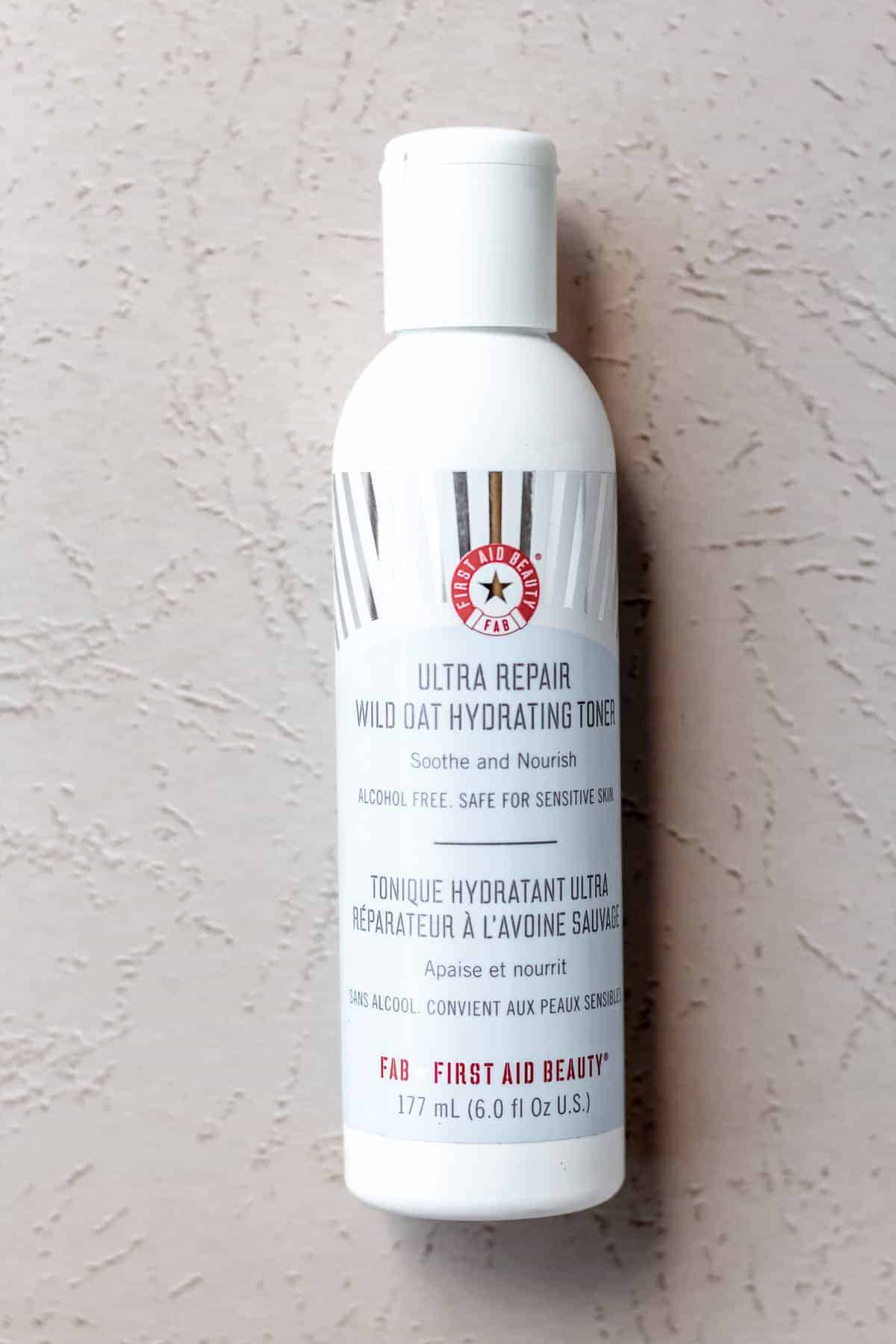 First Aid Beauty Ultra Repair Wild Oat Hydrating Toner on a light background