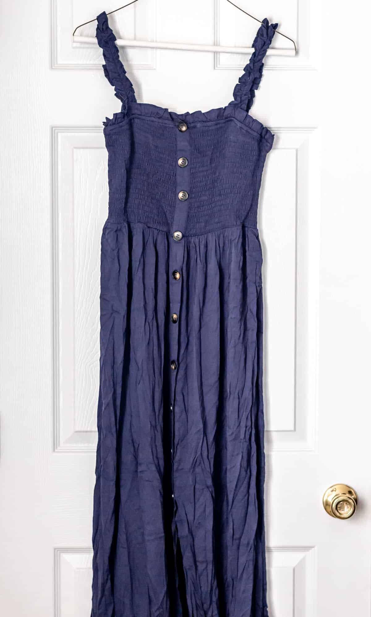 Button Front Shirred Split Cami Dress in dark blue on a hanger