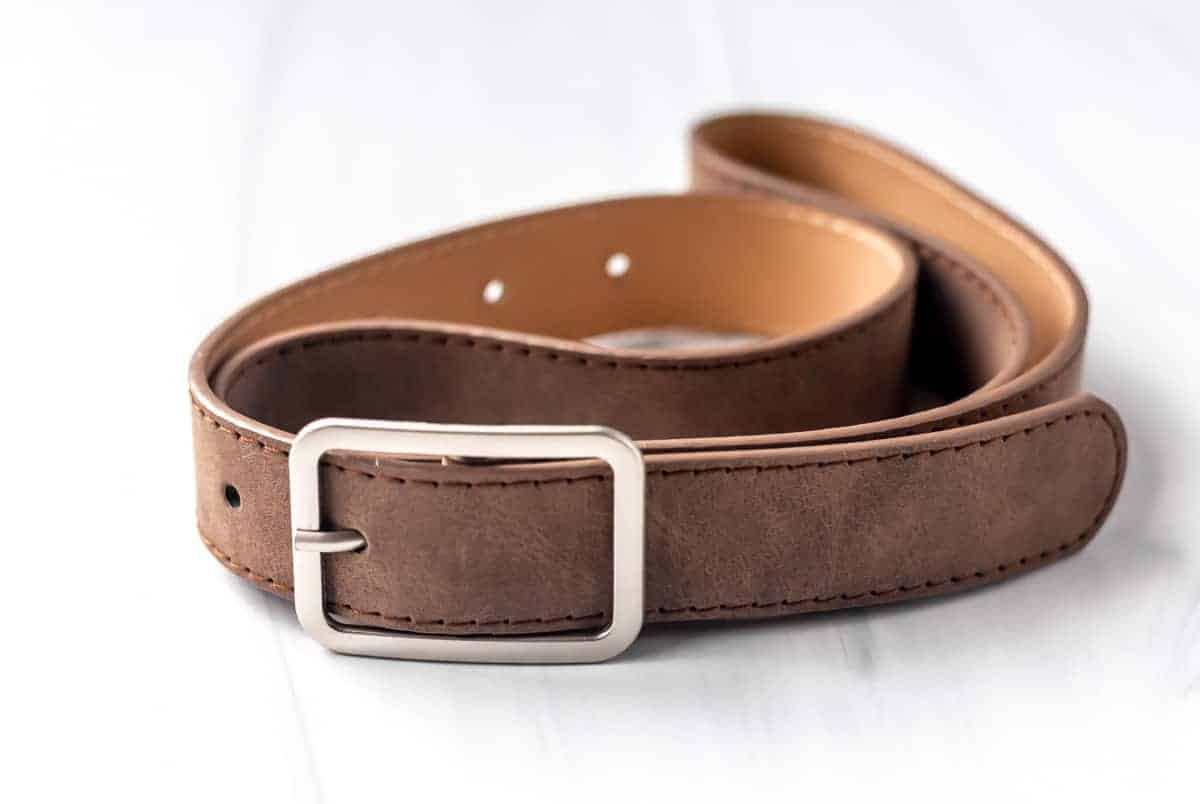 Geo Buckle Belt close up in brown on a white background