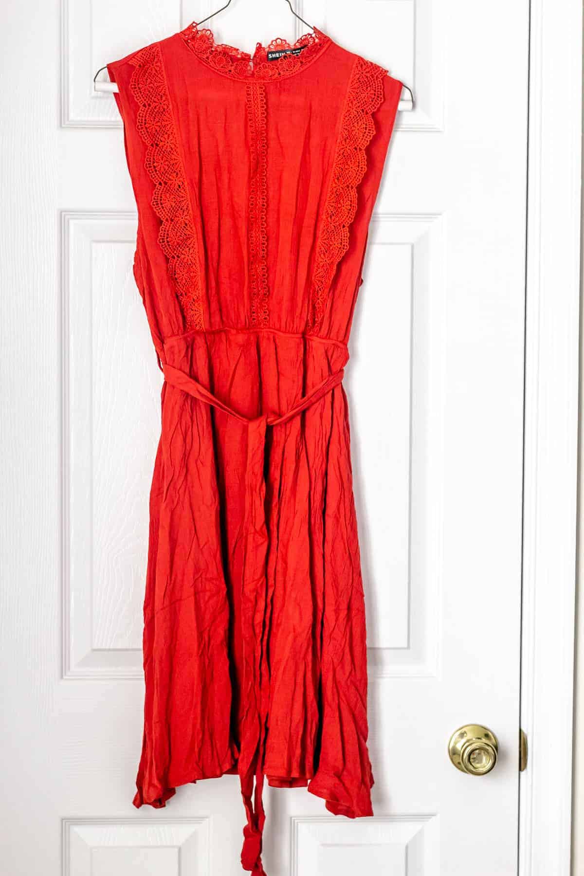 Contrast Lace Belted A-line Dress in red on a hanger