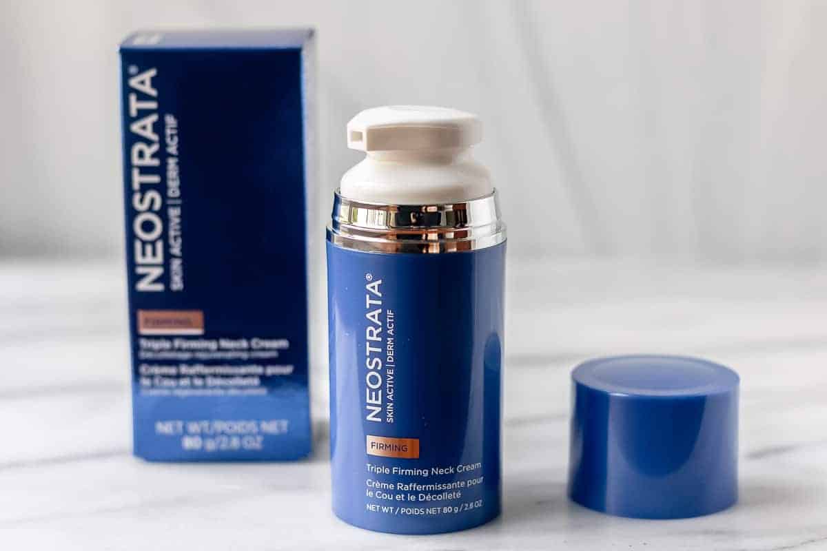 Neostrata triple firming neck cream box, bottle with the lid off and cap on a white background