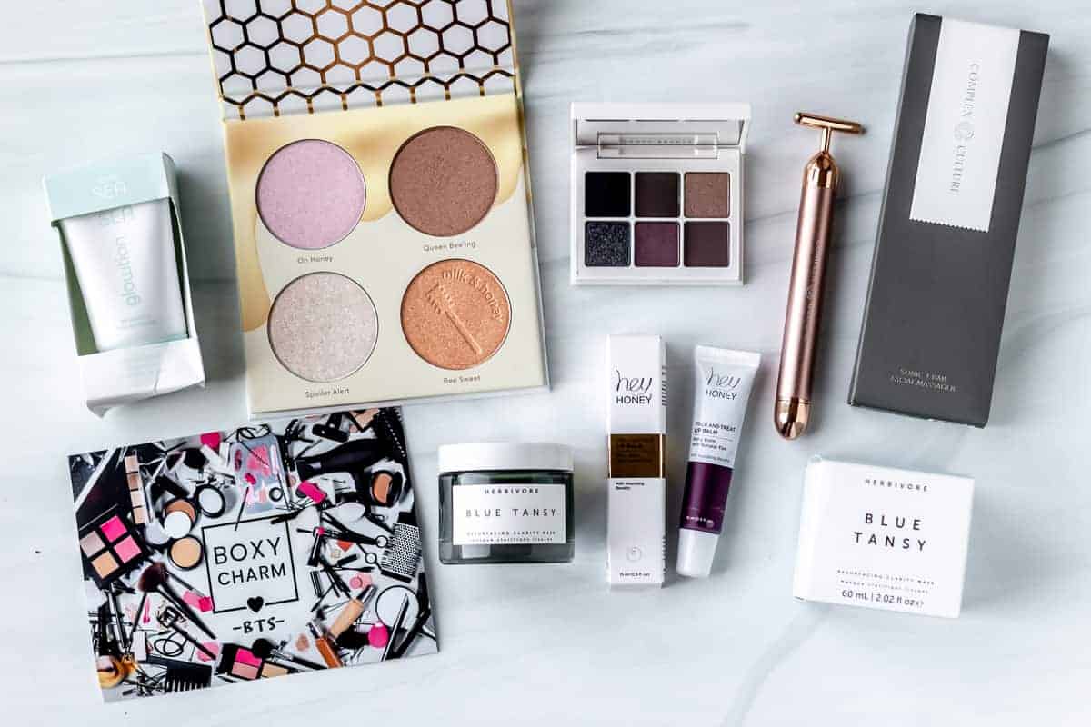 All of the products from my September 2021 Boxycharm Premium box laid out on a white surface.