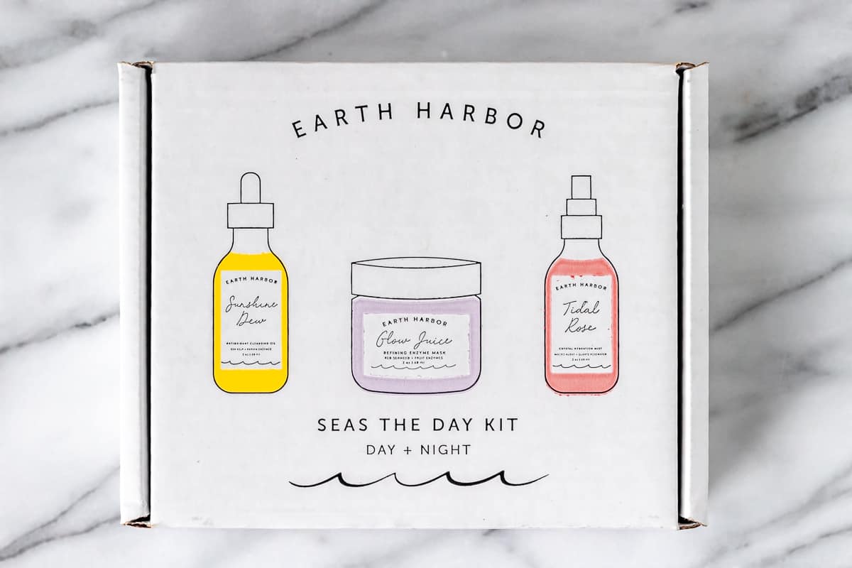 arth Harbor Seas The Day Luxury Skincare Bundle box on a marble background.