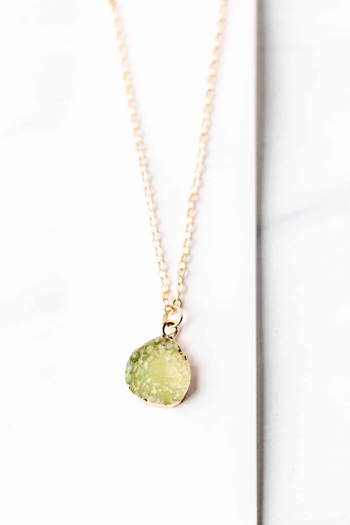 aux Gem Charm Necklace in green.