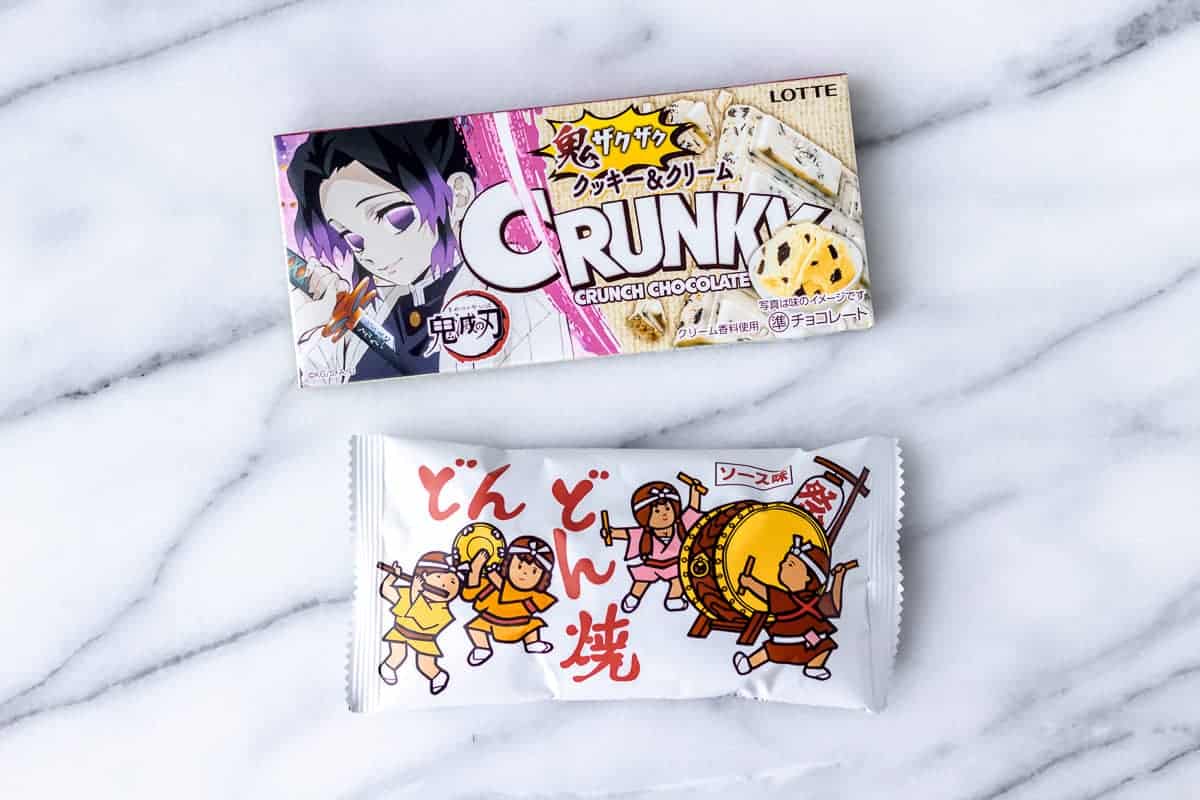Japanese candy bar and snack bag on a marble background.