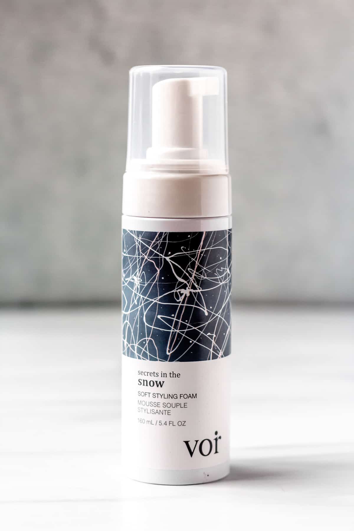 Voir Haircare Secrets In The Snow Soft Styling Foam bottle on a white and gray background.