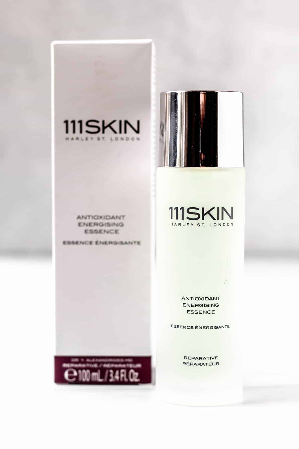 111Skin Antioxidant Energising Essence bottle and box on a white and gray background.