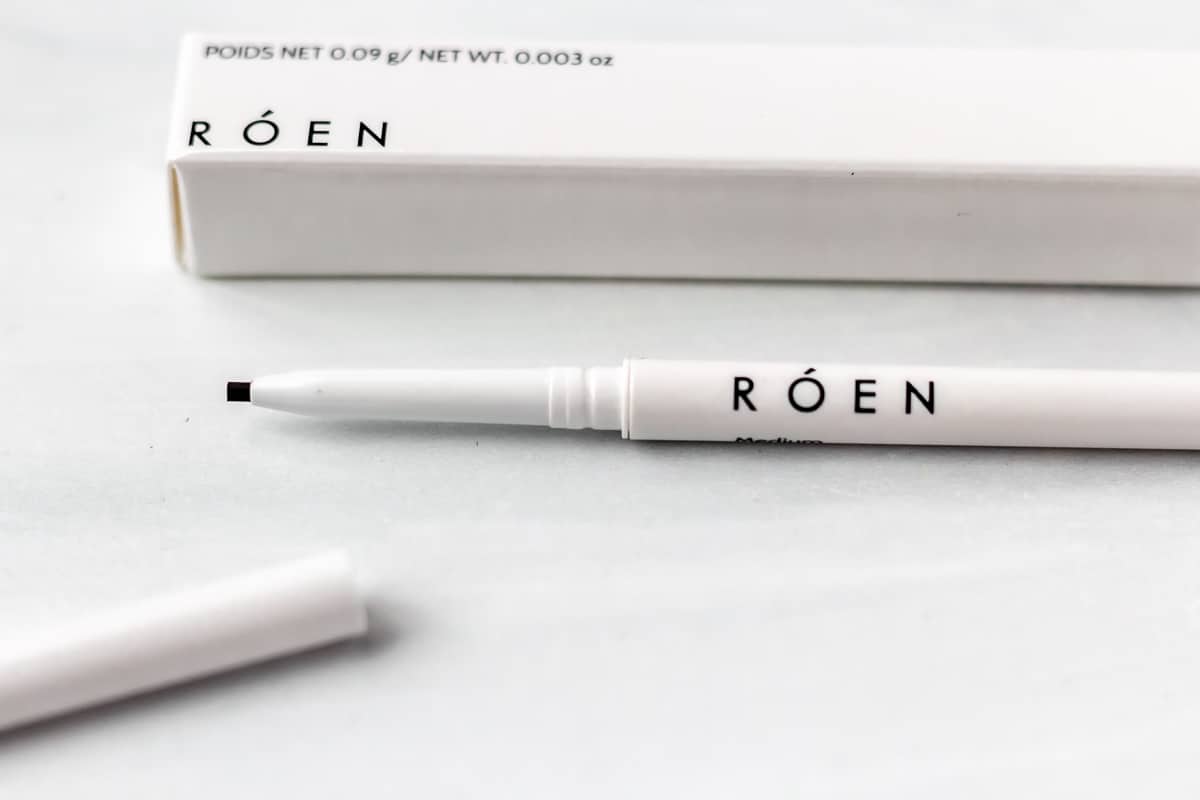 Close up of Roen Beauty VowBrow Pencil in Medium on a white background.