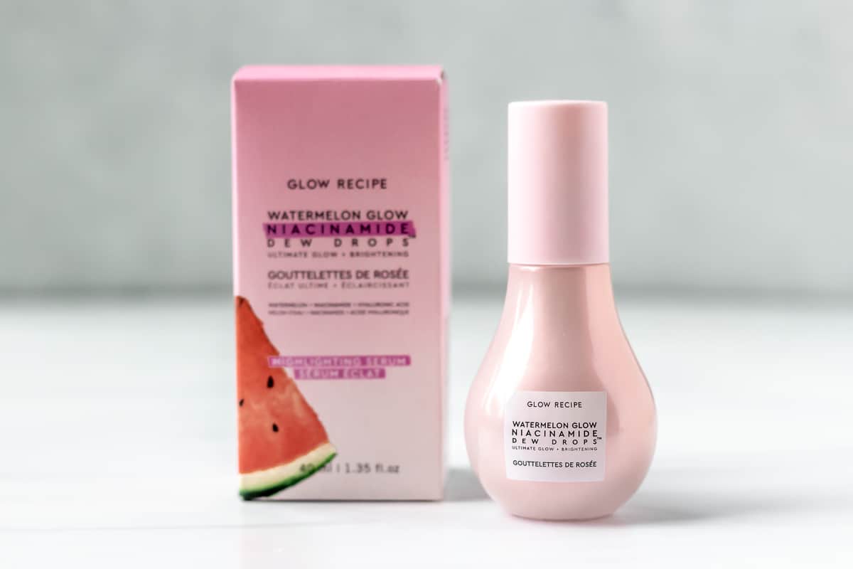 GLOW RECIPE Watermelon Glow Niacinamide Dew Drops box and bottle on a gray background.