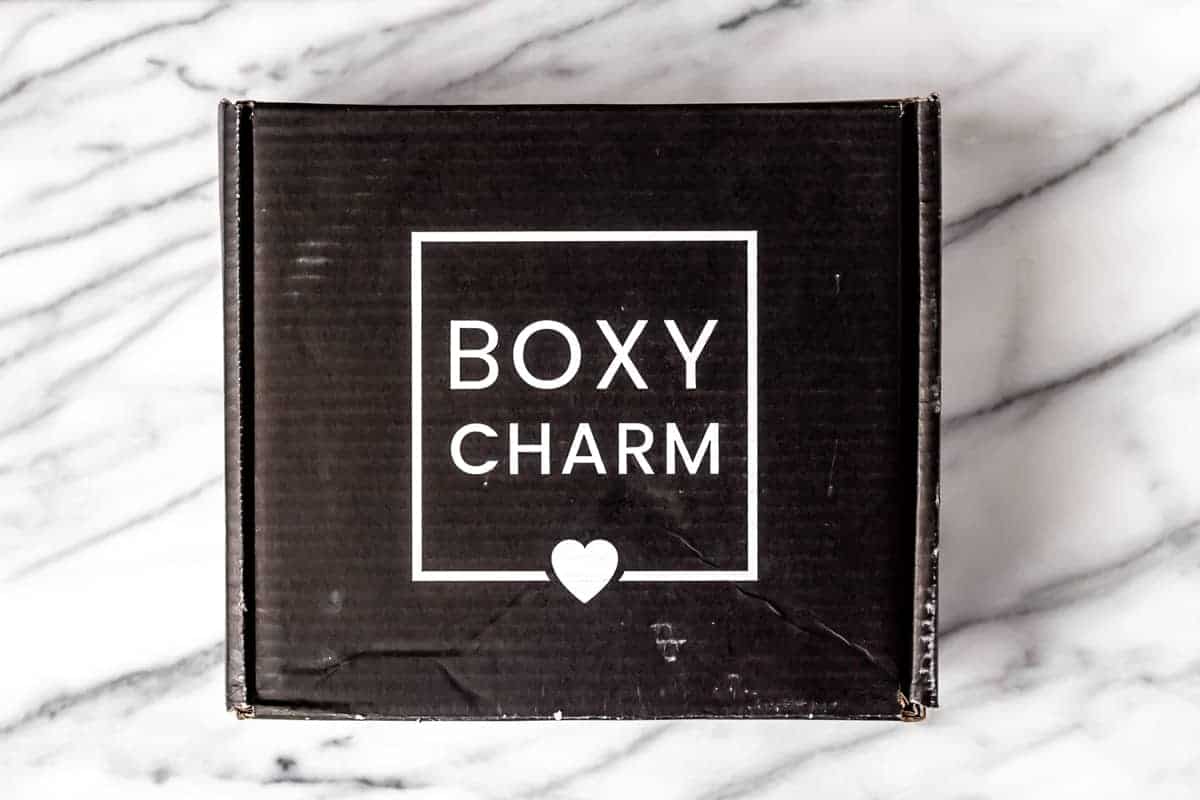November 2021 Boxycharm Premium box on a marble backdrop.