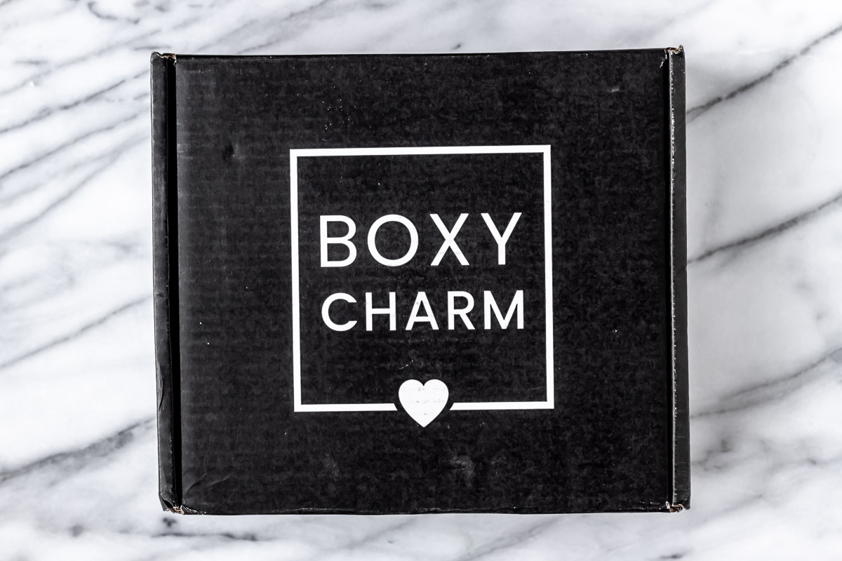 December 2021 Boxycharm Premium Box over a marble background.