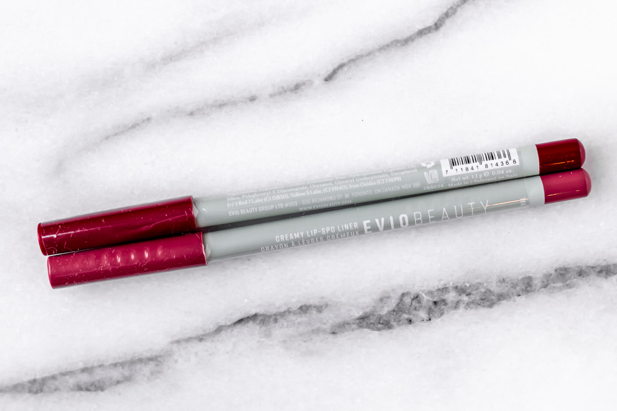 Evio Beauty Lip-spo Liner Duo on a marble background.