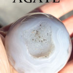 Agate sphere with text overlay.